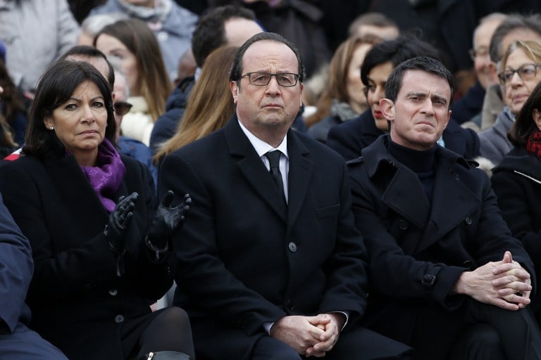 (From L) French Paris' Mayor Anne Hidalgo, French President Francois Hollande and French Prime Minister Manuel Valls attend a remembrance rally at Place de la Republique (Republic square) on January 10, 2016 to mark a year since 1.6 million people thronged the French capital in a show of unity after attacks on the Charlie Hebdo newspaper and a Jewish supermarket. (AFP / POOL / YOAN VALAT)
