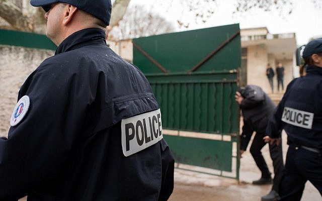 Police officers stand guard in front of the 'La Source' Jewish school in Marseille, southern France, after a Jewish teacher was attacked by a teenager wielding a machete, January 11, 2016. (AFP/BERTRAND LANGLOIS) Police officers stand guard in front of the 'La Source' Jewish school in Marseille, southern France, after a Jewish teacher was attacked by a teenager wielding a machete, January 11, 2016. (AFP/BERTRAND LANGLOIS)