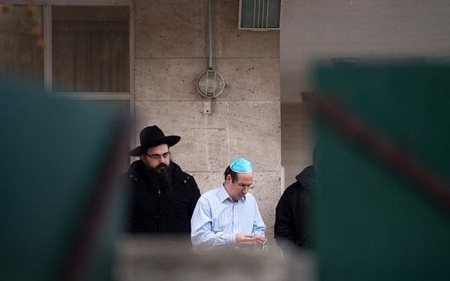 People stand in fron of the 'La Source' Jewish school in Marseille, southern France, on January 11, 2016, after a Jewish teacher was attacked by a teenager wielding a machete. (AFP / BERTRAND LANGLOIS) People stand in fron of the 'La Source' Jewish school in Marseille, southern France, on January 11, 2016, after a Jewish teacher was attacked by a teenager wielding a machete. (AFP / BERTRAND LANGLOIS)