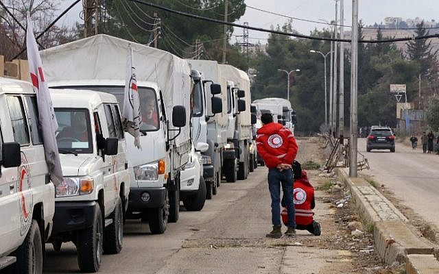 A convoy of aid from the International Committee of the Red Cross (ICRC) waits on the outskirts of the besieged rebel-held Syrian town of Madaya, on January 11, 2016. (AFP/Louai Beshara) A convoy of aid from the International Committee of the Red Cross (ICRC) waits on the outskirts of the besieged rebel-held Syrian town of Madaya, on January 11, 2016. (AFP/Louai Beshara)