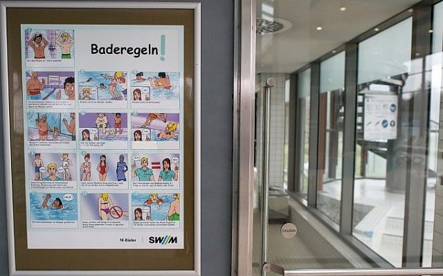 A poster informs about pool rules in a public swimming pool in Munich, southern Germany, on January 12, 2016. (Sven Hoppe/DPA/AFP) A poster informs about pool rules in a public swimming pool in Munich, southern Germany, on January 12, 2016. (Sven Hoppe/DPA/AFP)