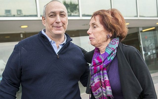Chemi Peres and Tsvia Walden, the children of former president Shimon Peres, talk to journalists outside the Tel Hashomer Hospital in Ramat Gan, near Tel Aviv, where their father is being treated for cardiovascular problems, on January 14, 2016. (AFP/JACK GUEZ)