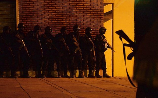 Burkina Faso soldiers take positions near a hotel and cafe during an attack by al-Qaeda-linked gunmen early on January 16, 2016 in Ouagadougou. (AFP/Ahmed Ouoba) Burkina Faso soldiers take positions near a hotel and cafe during an attack by al-Qaeda-linked gunmen early on January 16, 2016 in Ouagadougou. (AFP/Ahmed Ouoba)