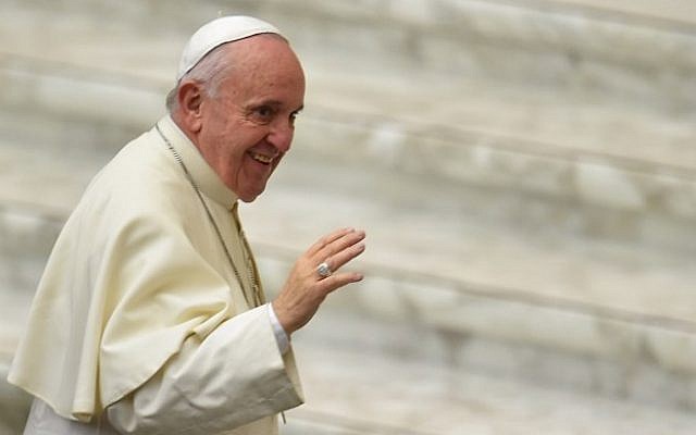 Pope Francis salutes members of the Christian Workers' Movement during an audience on January 16, 2016 in the Paul VI hall at the Vatican. (AFP Photo/Vincenzo Pinto) Pope Francis salutes members of the Christian Workers' Movement during an audience on January 16, 2016 in the Paul VI hall at the Vatican. (AFP Photo/Vincenzo Pinto)