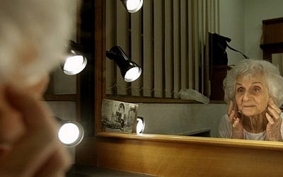 Hungarian Holocaust survivor Eva Fahidi, 90, prepares her make-up in her dressing room of the Vigszinhaz theater in Budapest on 15 January, 2016 (Peter Kohalmi/AFP)