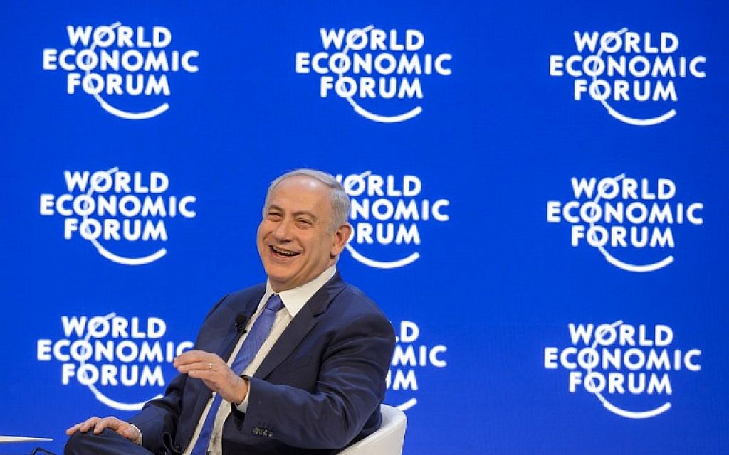 Prime Minister Benjamin Netanyahu laughs during a conference at the World Economic Forum (WEF) annual meeting in Davos, on January 21, 2016. (AFP/FABRICE COFFRINI) Prime Minister Benjamin Netanyahu laughs during a conference at the World Economic Forum (WEF) annual meeting in Davos, on January 21, 2016. (AFP/FABRICE COFFRINI)