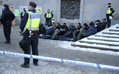 Swedish police surrounds an arrested group of neo-Nazis that staged an unannounced rally in Stockholm following a brawl on January 23, 2016. (AFP/TT NEWS AGENCY/Jessica Gow) Swedish police surrounds an arrested group of neo-Nazis that staged an unannounced rally in Stockholm following a brawl on January 23, 2016. (AFP/TT NEWS AGENCY/Jessica Gow)