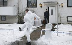 Police investigators are seen outside a home for juvenile asylum seekers in Molndal in southwestern Sweden on January 25, 2016 following the stabbing death of a shelter employee. (Adam Ihse/TT News Agency/AFP)