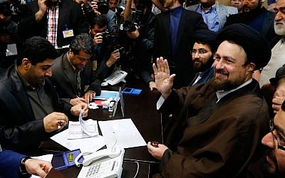 Hassan Khomeini, right, grandson of the Islamic Republic of Iran's founder, Ayatollah Ruhollah Khomeini, registering his candidacy for the Assembly of Experts elections at the interior ministry in Tehran on December 18, 2015. (AFP/STR)