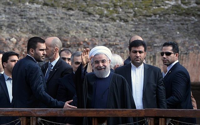 Iranian President Hassan Rouhani, center, waves to photographers during his visit to Rome's Coliseum January 27, 2016. (AFP/FILIPPO MONTEFORTE) Iranian President Hassan Rouhani, center, waves to photographers during his visit to Rome's Coliseum January 27, 2016. (AFP/FILIPPO MONTEFORTE)