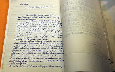 The first page of a handwritten clemency plea by Nazi war criminal Adolf Eichmann revealed to the public on January 27, 2016 during a ceremony at the presidential compound in Jerusalem marking 55 years since Eichmann's trial, as the world observes International Holocaust Remembrance Day. (AFP/GALI TIBBON)