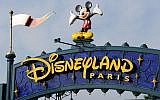 This file photo taken on August 13, 2015 shows a sign above the entrance at Disneyland Paris in Marne-la-Vallee. (AFP / BERTRAND GUAY)