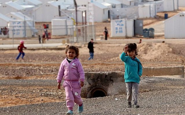 Young Syrian refugees stand at the Azraq refugee camp in northern Jordan on January 30, 2016. (Khalil Mazraawi/AFP)