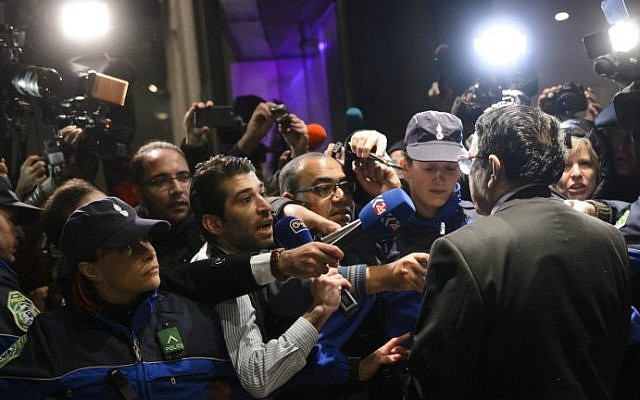 High Negotiations Committee (HNC) spokesman Riyad Naasan Agha of Syria's main opposition body (R back) briefs the press upon his arrival on January 30, 2016 in Geneva for peace talks. (Fabrice Coffrini/AFP)