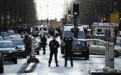 French police officers on patrol at the Boulevard de Barbes in the north of Paris on January 7, 2016, after police shot a man dead as he was trying to enter a police station in the Rue de la Goutte d'Or. (LIONEL BONAVENTURE/AFP)