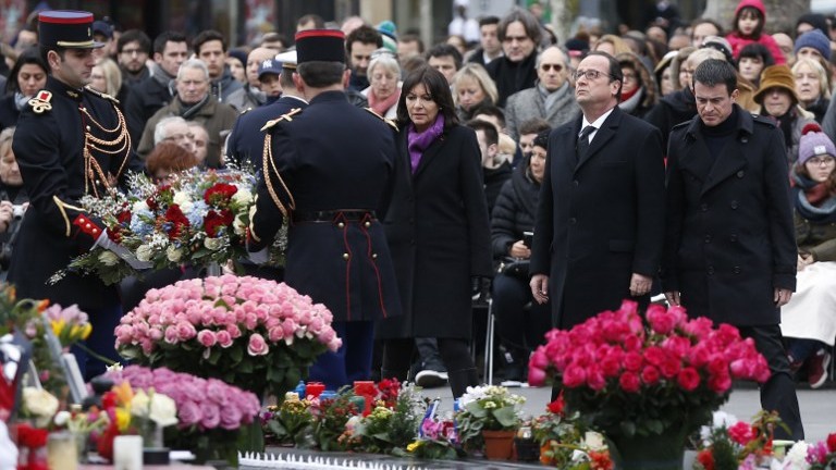 Paris mayor Anne Hidalgo, French President Francois Hollande, and French Prime minister Manuel Valls, attend a remembrance rally at Place de la Republique (Republic square) on January 10, 2016 in Paris, a year after attacks on the Charlie Hebdo newspaper and a Jewish supermarket. (AFP PHOTO / THOMAS SAMSON) Paris mayor Anne Hidalgo, French President Francois Hollande, and French Prime minister Manuel Valls, attend a remembrance rally at Place de la Republique (Republic square) on January 10, 2016 in Paris, a year after attacks on the Charlie Hebdo newspaper and a Jewish supermarket. (AFP PHOTO / THOMAS SAMSON)