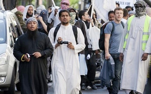 A picture taken on September 11, 2011 shows a man identified by local media as Siddharta Dhar (C) taking part in a demonstration outside the US Embassy in London on the tenth anniversary of the 9/11 attacks on the United States. (AFP Photo/Justin Tallis) A picture taken on September 11, 2011 shows a man identified by local media as Siddharta Dhar (C) taking part in a demonstration outside the US Embassy in London on the tenth anniversary of the 9/11 attacks on the United States. (AFP Photo/Justin Tallis)