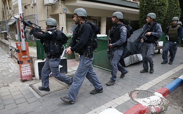 Israeli security forces patrol the area of an attack by a gunman, who opened fire at a pub in central Tel Aviv killing two people and wounding seven others on January 1, 2016. (AFP PHOTO/JACK GUEZ) Israeli security forces patrol the area of an attack by a gunman, who opened fire at a pub in central Tel Aviv killing two people and wounding seven others on January 1, 2016. (AFP PHOTO/JACK GUEZ)