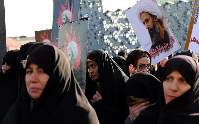 Iranian women gather during a demonstration against the execution of prominent Shiite Muslim cleric Nimr al-Nimr by Saudi authorities, at Imam Hossein Square in the capital Tehran, January 4, 2016. (AFP/ ATTA KENARE)