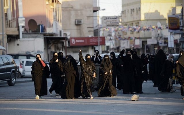 Bahraini women shout slogan during clashes with riot police following a protest against the execution of prominent Shiite Muslim cleric Nimr al-Nimr by Saudi authorities, in the village of Daih, west of the capital Manama on January 4, 2016. (AFP/MOHAMMED AL-SHAIKH) Bahraini women shout slogan during clashes with riot police following a protest against the execution of prominent Shiite Muslim cleric Nimr al-Nimr by Saudi authorities, in the village of Daih, west of the capital Manama on January 4, 2016. (AFP/MOHAMMED AL-SHAIKH)
