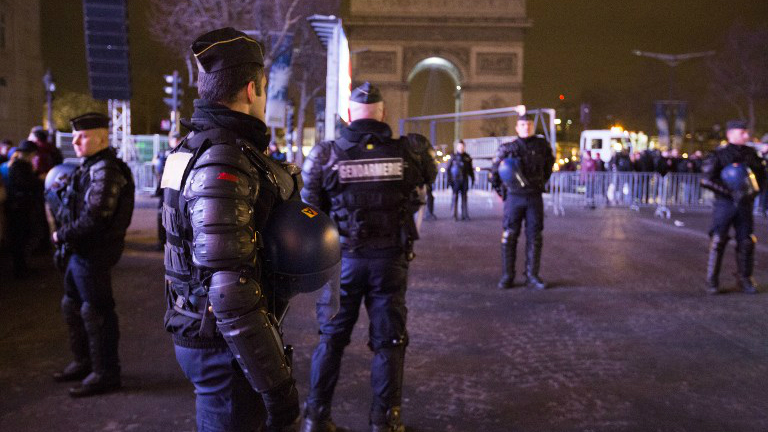 Police on patrol ahead of New Year's celebrations on the Champs-Elysees just before midnight in Paris on December 31, 2015. (AFP Photo/Florian David) Police on patrol ahead of New Year's celebrations on the Champs-Elysees just before midnight in Paris on December 31, 2015. (AFP Photo/Florian David)
