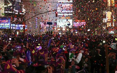 People take part in celebrations at Times Square on January 1, 2016 in New York City. (Eduardo Munoz Alvarez/Getty Images/AFP)