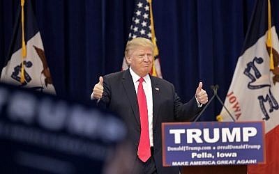 Republican presidential candidate Donald Trump gives a thumbs-up as he is introduced during a campaign event January 23, 2016 in Pella, Iowa.  (Joshua Lott/Getty Images/AFP)
