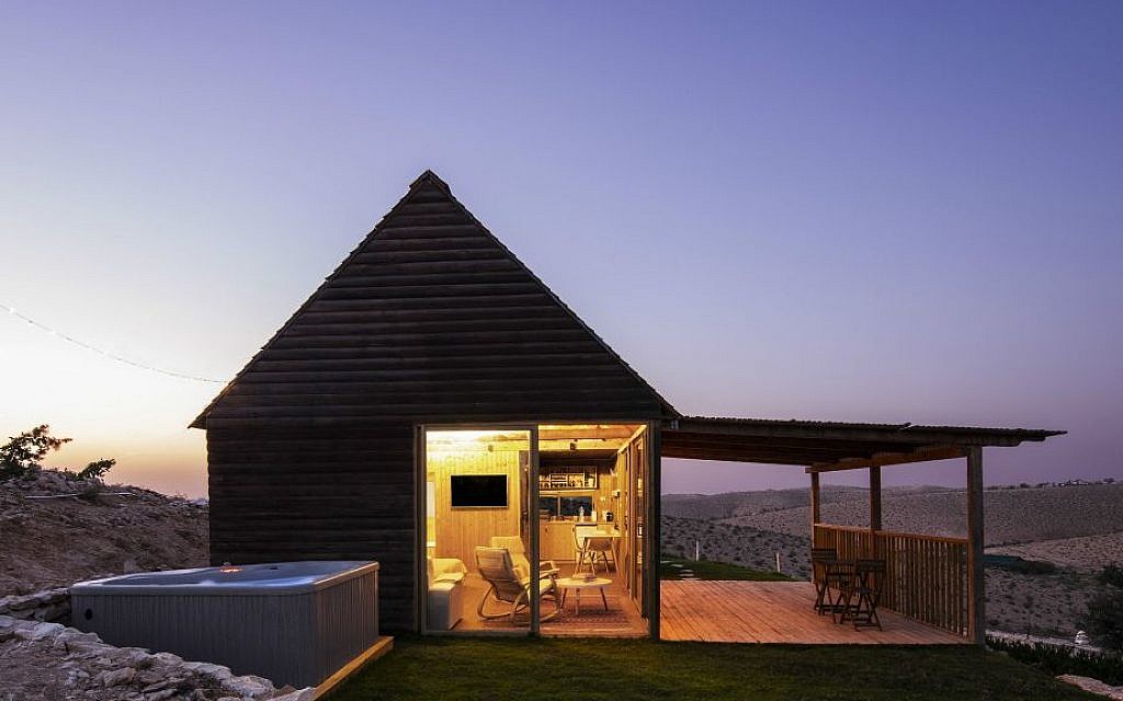 The Klingers' main guest cabin sits high on a secluded hill, with multiple sliding doors to the view and a hot tub in the yard (Courtesy Aviad Bar-Ness)