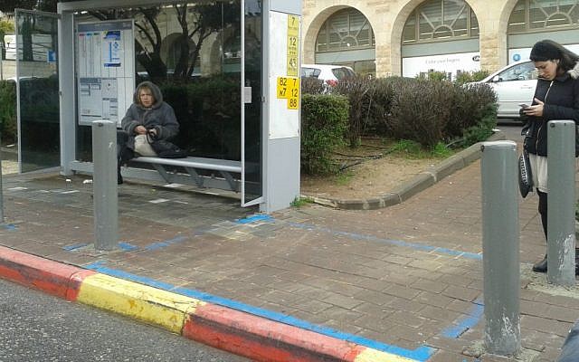 A protected bus stop in Jerusalem made accessible for people in wheelchairs. (Shekel)
