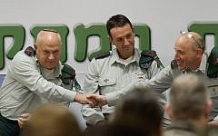 Brig. Gen. Eli Ben-Meir, left, shakes hands with Brig. Gen. (res.) Itai Brun, right, as Ben-Meir takes over as head of the IDF's Research Brigade, during a ceremony, with head of army intelligence Maj. Gen. Herzi Halevi, on January 4, 2015. (IDF Spokesperson's Unit)