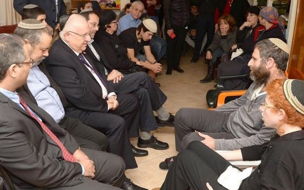 President Reuven Rivlin pays a condolence visit to the family of terror victim Dafna Meir in Otniel on January 21, 2016,  four days after she was murdered in a terror attack at her home (Photo: Mark Neyman/GPO)
