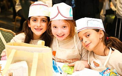 More than 1,100 children learned to make challah at Kids Mega Challah Bake in New York, January 12, 2016. (Benams Photo/Courtesy of Chabad via JTA) More than 1,100 children learned to make challah at Kids Mega Challah Bake in New York, January 12, 2016. (Benams Photo/Courtesy of Chabad via JTA)