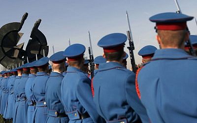 A Serbian military honor guard pay homage to the victims of the Holocaust at a monument in World War II Nazi concentration camp Sajmiste, in Belgrade, Serbia, Wednesday, on 27, 2016. The international Holocaust remembrance day marks the liberation of the Nazi concentration camp Auschwitz on Jan. 27, 1945. (AP Photo/Darko Vojinovic)