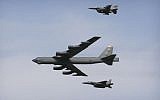 A US Air Force B-52 bomber flies over Osan Air Base in Pyeongtaek, South Korea,  January 10, 2016. (AP Photo/Ahn Young-joon)