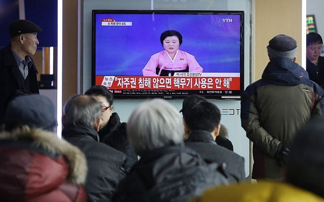People watch a TV news program showing North Korea's announcement, at the Seoul Railway Station in Seoul, South Korea, January 6, 2016. (AP/Ahn Young-joon)