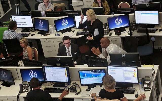 Al Jazeera America editorial newsroom staff preparing for their first broadcast in New York, August 20, 2013. (AP/Bebeto Matthews, File) Al Jazeera America editorial newsroom staff preparing for their first broadcast in New York, August 20, 2013. (AP/Bebeto Matthews, File)