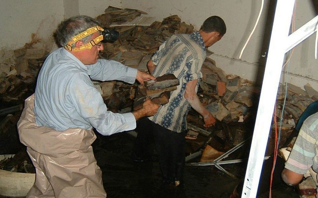 Volunteers attempt to recover Iraqi Jewish archival material from the flooded basement of the Mukhabarat, Saddam Hussein’s intelligence headquarters, 2003. (Harold Rhode, Courtesy of the US National Archives) Volunteers attempt to recover Iraqi Jewish archival material from the flooded basement of the Mukhabarat, Saddam Hussein’s intelligence headquarters, 2003. (Harold Rhode, Courtesy of the US National Archives)