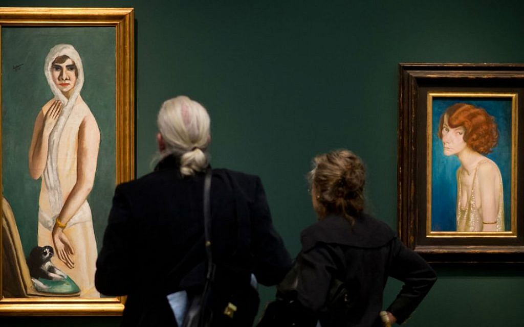 Visitors viewing Max Beckmann's 'Portrait Quappi Beckmann,' from 1925, at the Hypo-Kunsthalle in Munich, Germany, April 10, 2014. (Joerg Koch/Getty Images/via JTA) Visitors viewing Max Beckmann's 'Portrait Quappi Beckmann,' from 1925, at the Hypo-Kunsthalle in Munich, Germany, April 10, 2014. (Joerg Koch/Getty Images/via JTA)