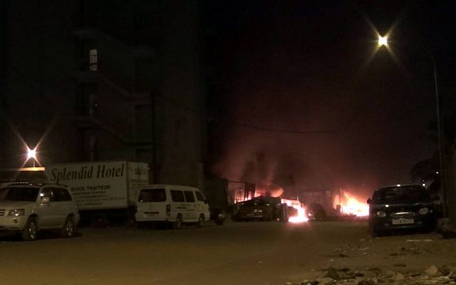 In this grab taken from video by Associate Press Television, the scene of an attack on a hotel, in Ouagadougou, Burkina Faso, Friday, Jan. 15, 2016. Attackers struck an upscale hotel popular with Westerners in Burkina Faso's capital late Friday, fueling the recent political turmoil in the West African country. Three hours later, gunfire could still be heard as soldiers in an armored vehicle finally approached the area. (AP Television) In this grab taken from video by Associate Press Television, the scene of an attack on a hotel, in Ouagadougou, Burkina Faso, Friday, Jan. 15, 2016. Attackers struck an upscale hotel popular with Westerners in Burkina Faso's capital late Friday, fueling the recent political turmoil in the West African country. Three hours later, gunfire could still be heard as soldiers in an armored vehicle finally approached the area. (AP Television)