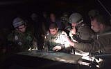 Col. Yariv Ben-Ezra, commander of the IDF's Judea Regional Brigade, works with his officers in the field as they search for the man who stabbed and killed an Israeli woman in her home in the Otniel settlement in the West Bank on January 17, 2016. (IDF Spokesperson's Unit)