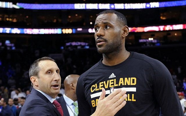 In this Nov. 2, 2015, file photo, Cleveland Cavaliers coach David Blatt pats LeBron James on the chest at the end of an NBA basketball game against the Philadelphia 76ers in Philadelphia. (AP Photo/Michael Perez, File)