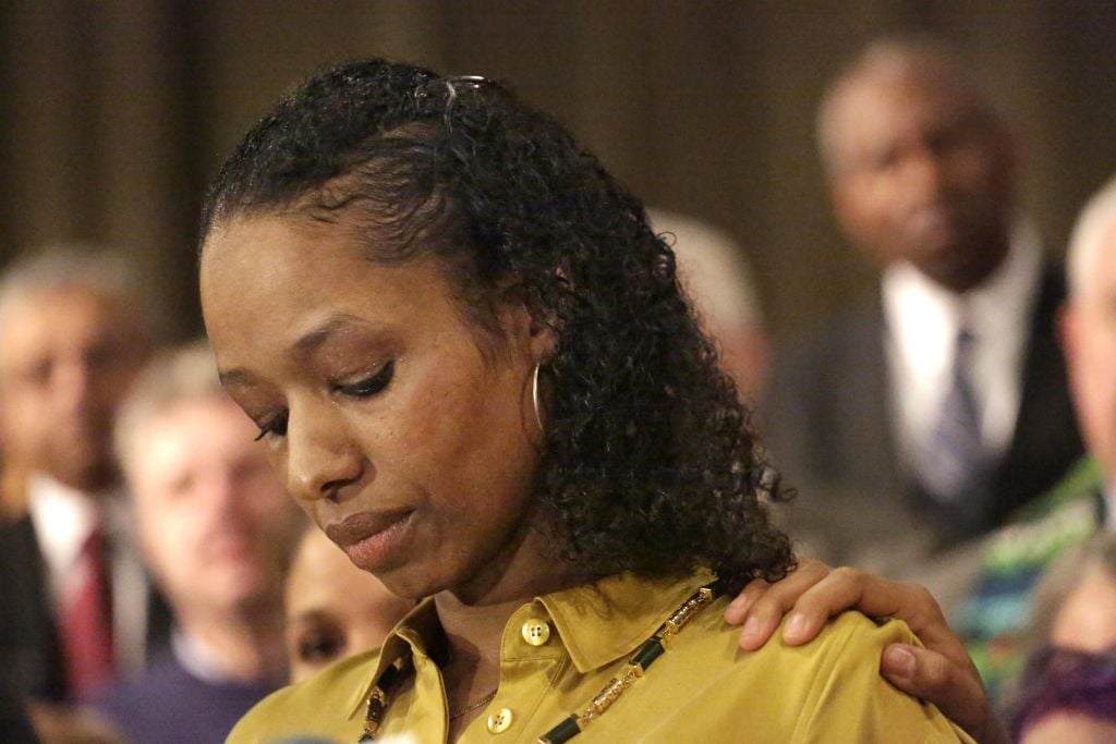 Wheaton College professor Larycia Hawkins pauses during a news conference Wednesday, Jan. 6, 2016, in Chicago. Hawkins, who's Christian, and posted her views on Facebook and wore a headscarf to show solidarity with Muslims, is disputing the university's account of interactions with administrators who've initiated steps to fire her. (AP Photo/M. Spencer Green) Wheaton College professor Larycia Hawkins pauses during a news conference Wednesday, Jan. 6, 2016, in Chicago. Hawkins, who's Christian, and posted her views on Facebook and wore a headscarf to show solidarity with Muslims, is disputing the university's account of interactions with administrators who've initiated steps to fire her. (AP Photo/M. Spencer Green)