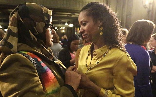 Wheaton College professor Larycia Hawkins, right, is greeted by supporter Donna Demir after a news conference Wednesday, Jan. 6, 2016, in Chicago. (AP Photo/M. Spencer Green) Wheaton College professor Larycia Hawkins, right, is greeted by supporter Donna Demir after a news conference Wednesday, Jan. 6, 2016, in Chicago. (AP Photo/M. Spencer Green)