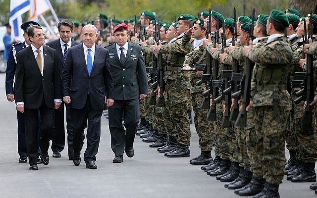 Prime Minister Benjamin Netanyahu and Cypriot President Nicos Anastasides review a military guard of honor during a welcome ceremony at the presidential palace in the Cypriot capital, January 28, 2016. (Yiannis Kourtoglou, Pool Photo via AP) Prime Minister Benjamin Netanyahu and Cypriot President Nicos Anastasides review a military guard of honor during a welcome ceremony at the presidential palace in the Cypriot capital, January 28, 2016. (Yiannis Kourtoglou, Pool Photo via AP)