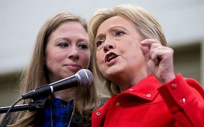 Democratic presidential candidate Hillary Clinton, accompanied by her daughter Chelsea Clinton, speaks at the African American Festival, I'll Make Me a World Celebration Day at the Iowa Events Center in Des Moines, Iowa, Saturday, Jan. 30, 2016. (AP Photo/Andrew Harnik)
