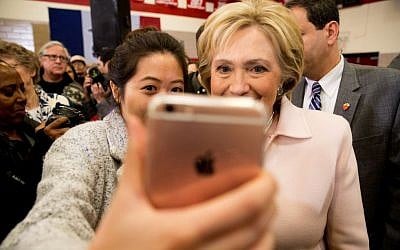 Democratic presidential candidate Hillary Clinton takes a photograph with a member of the audience after speaking at a rally at Grand View University in Des Moines, Iowa, Friday, Jan. 29, 2016. (AP Photo/Andrew Harnik)