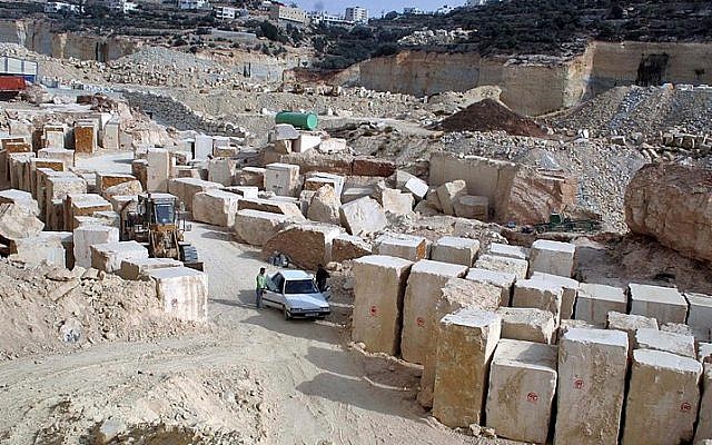 Palestinian laborers work at a quarry in the West Bank village of Taffouh near Hebron October 17, 2009. Stone and marble factories and quarries, located mainly in the West Bank cities of Bethlehem and Hebron, are at the core of the Palestinian industrial sector. (Najeh Hashlamoun/Flash90) Palestinian laborers work at a quarry in the West Bank village of Taffouh near Hebron October 17, 2009. Stone and marble factories and quarries, located mainly in the West Bank cities of Bethlehem and Hebron, are at the core of the Palestinian industrial sector. (Najeh Hashlamoun/Flash90)
