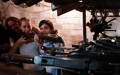 Tourists at the 'slik,' or hidden weapons cache, in Kfar Giladi (Yossi Zamir/Flash90)