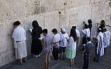 Illustrative: Conservative Jews pray at the section prepared for prayer for the Women of the Wall at Robinson's Arch in Jerusalem's Old City on July 30, 2014. (Robert Swift/Flash90)