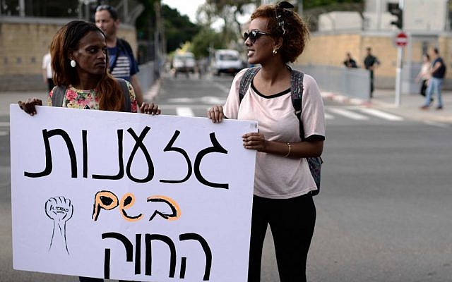 Israeli-Ethiopians and activists shout slogans during a protest march in Tel Aviv. Israeli-Ethiopians and activists shout slogans during a protest march in Tel Aviv.